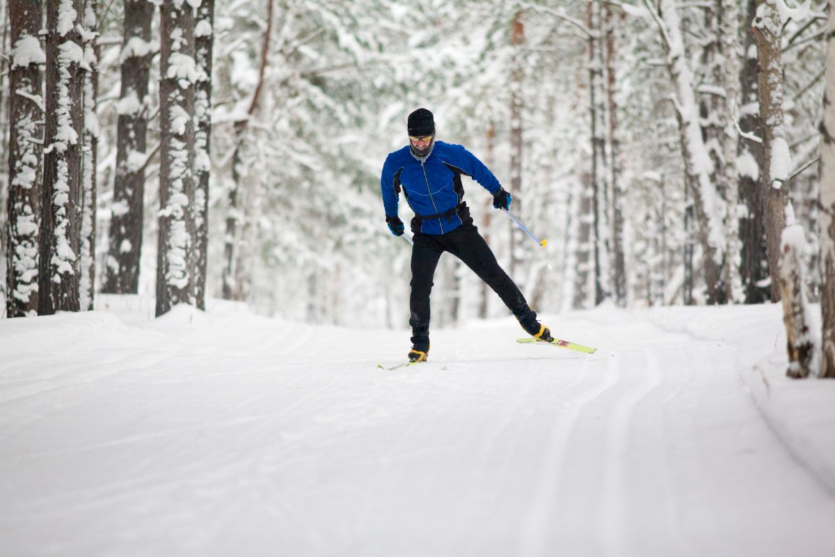 Man skier skiing on slope.