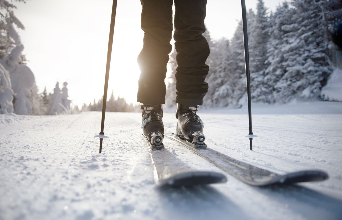 Skier's foot on winter slope.