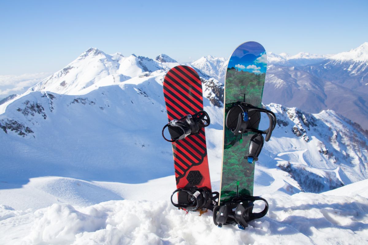 Two snowboards on snow slope.